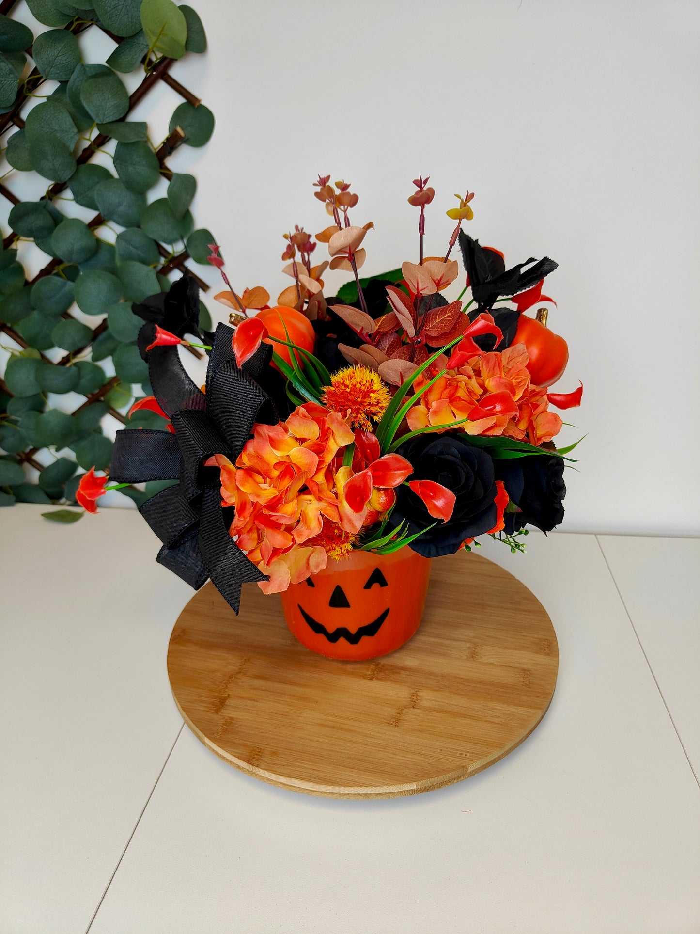 Pumpkin Halloween flower arrangement black roses