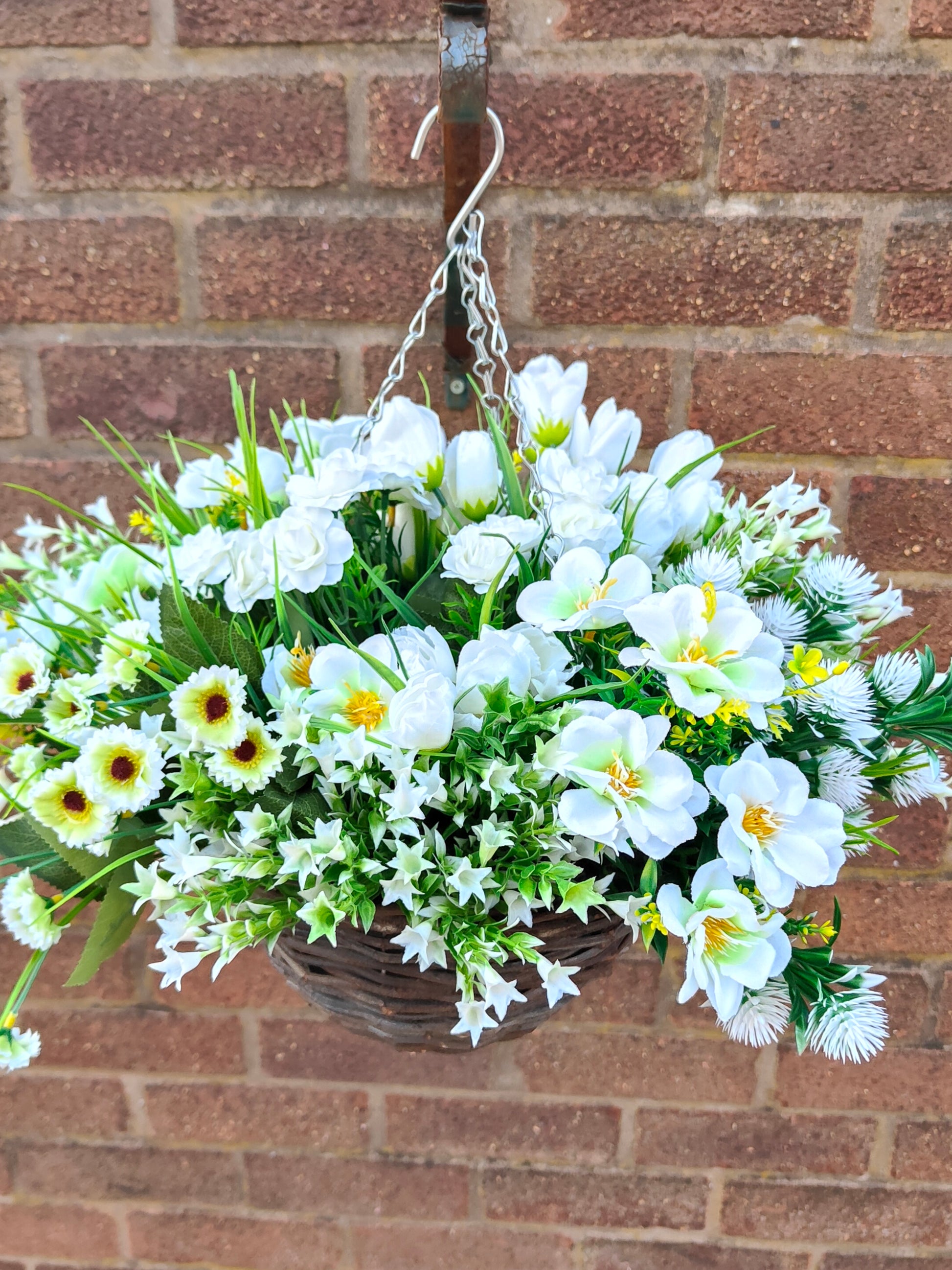 White artificial flower hanging basket 