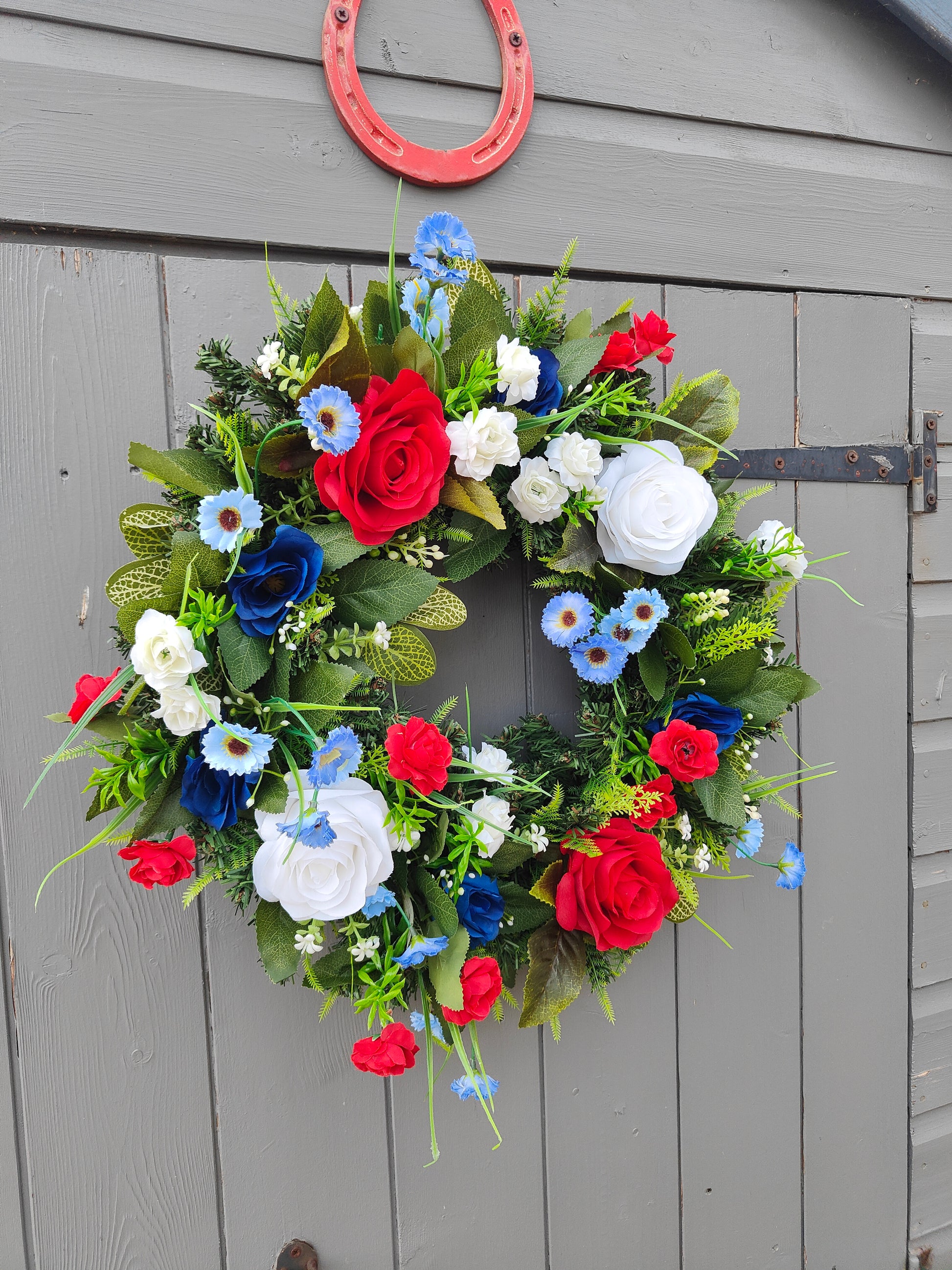 artificial flower wreath

royal celebration wreath

American flag color wreath

