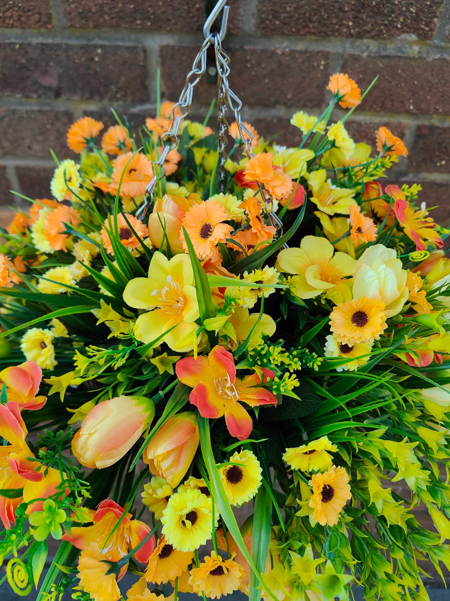 Yellow orange faux flower hanging basket 