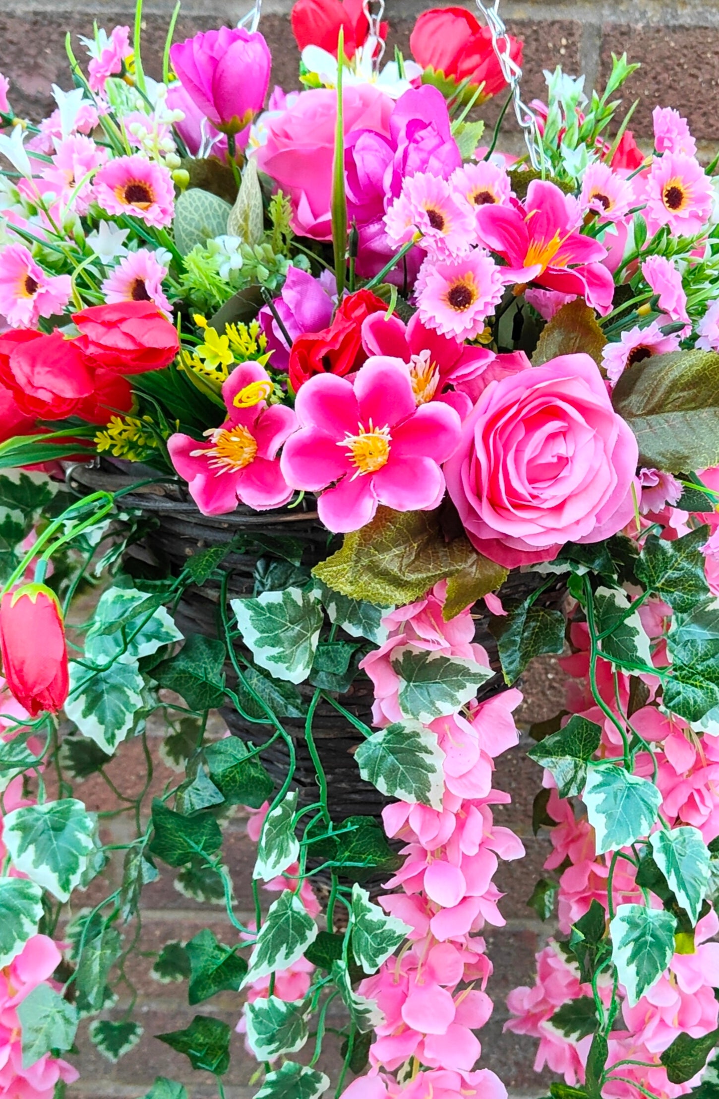 Pink artificial flower hanging basket 